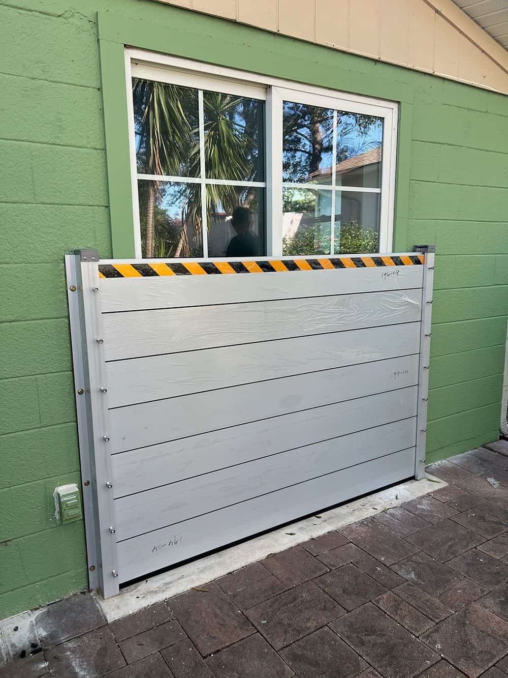 HydroDam flood barrier protecting a home entry door in Pinellas County